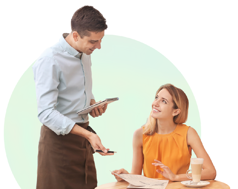 Staff member with a customer in a cafe